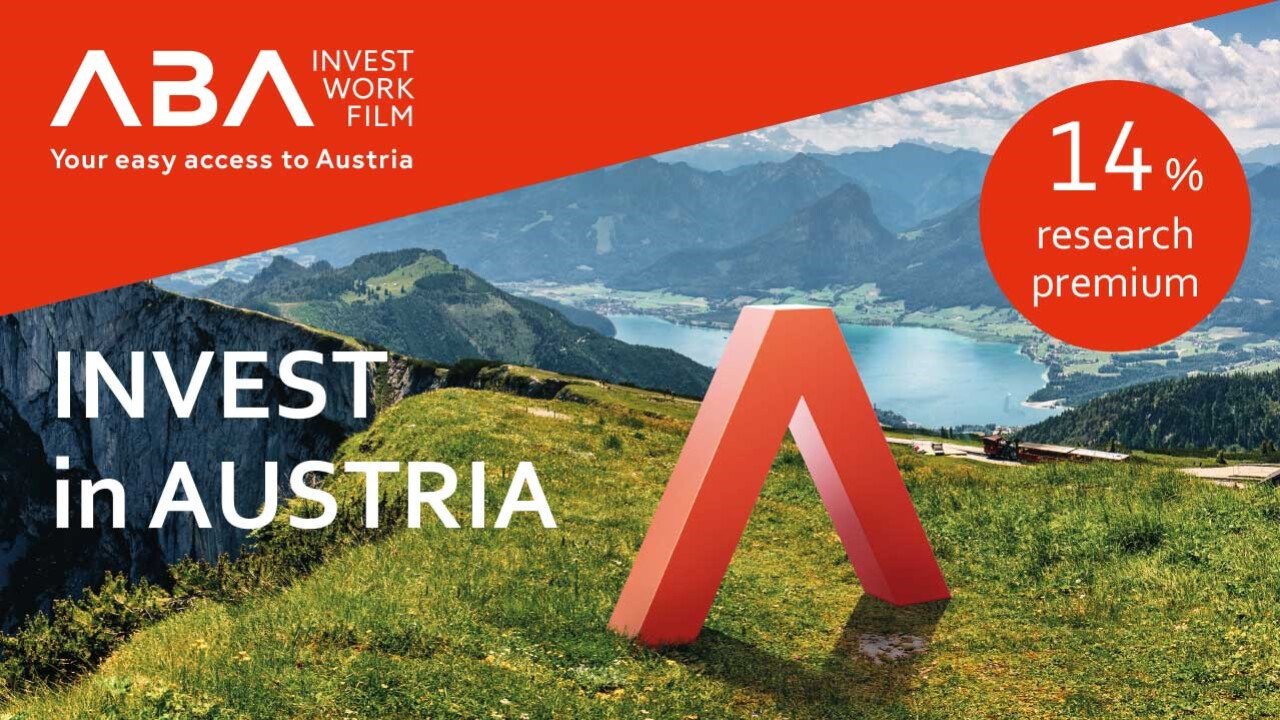 Es ist das Logo der Austrian Business Agency vor einer Berglandschaft mit See und Wiese zu sehen. Außerdem wird per Schriftzug die 14%% Forschungsprämie beworben.